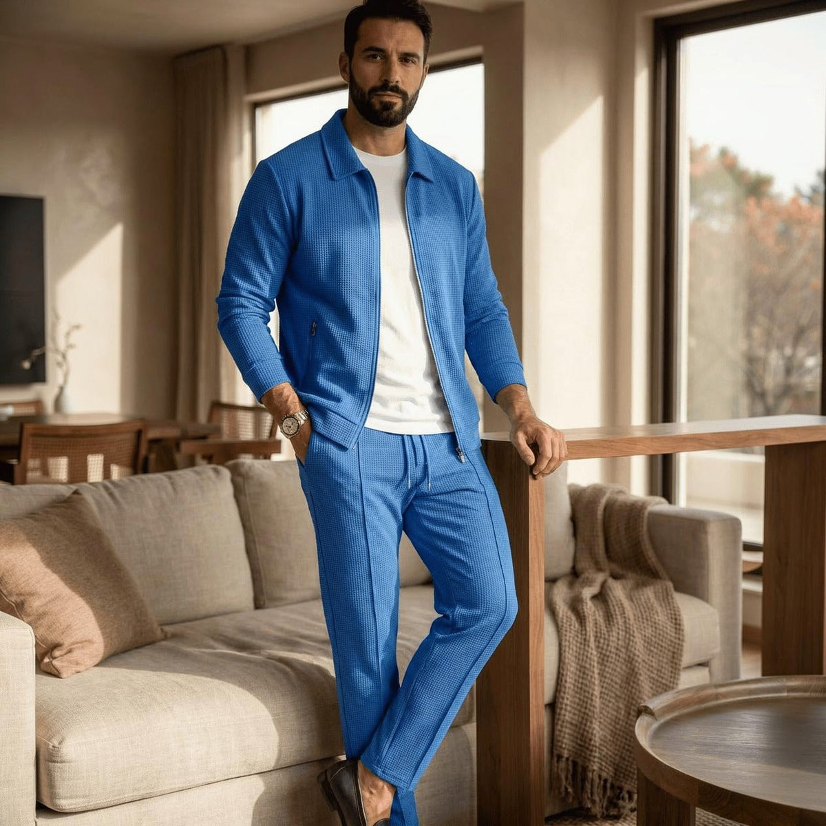 Man wearing blue waffle texture zip jacket and matching pants, indoors | Chaps London