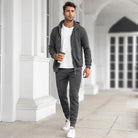 Man wearing grey zip hoodie tracksuit with white t-shirt, walking outdoors | Chaps London
