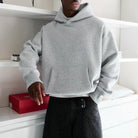 Man wearing gray oversized hoodie with front pocket, worn on body | Chaps London