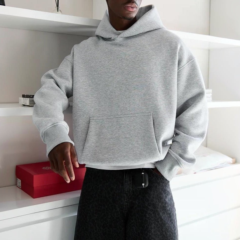 Man wearing gray oversized hoodie with front pocket, worn on body | Chaps London