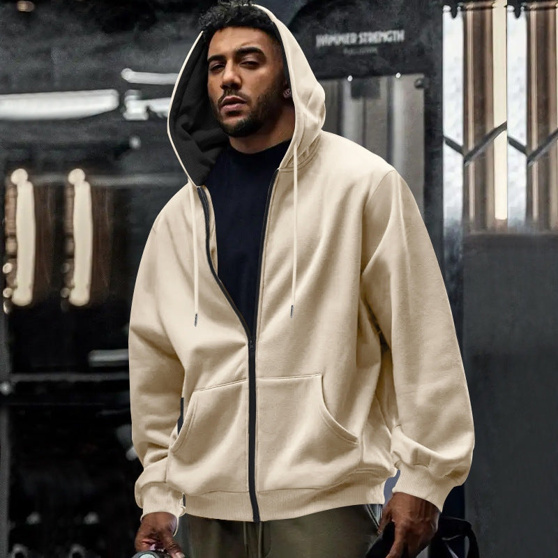 Men's oversized zip-up hoodie in cream, worn, front view