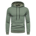 Sage green drawstring hoodie with kangaroo pocket, worn by a person | Chaps London