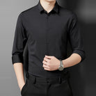 Black point collar shirt with rolled sleeves worn by a man | Chaps London