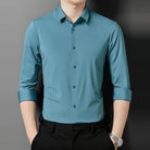 Teal point collar long sleeve shirt worn by man with black trousers | Chaps London