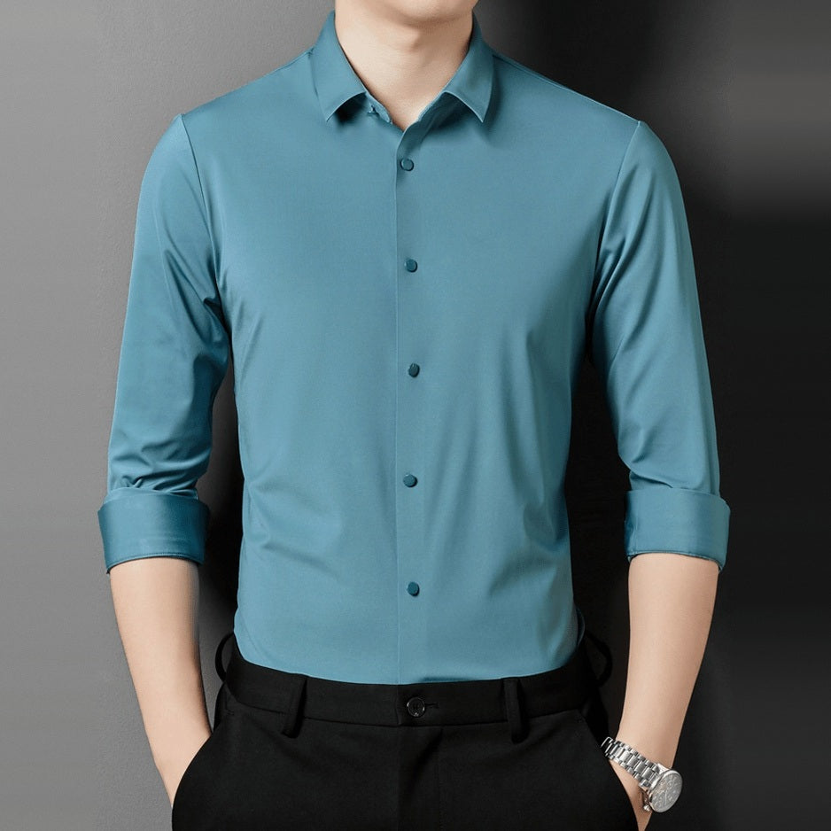 Teal point collar long sleeve shirt worn by man with black trousers | Chaps London