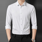 White point collar long sleeve shirt worn by man with black trousers | Chaps London