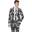 Man wearing black and white Halloween print suit jacket, trousers, and tie | Chaps London