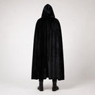 Man wearing long black hooded velvet cloak, standing, rear view | Chaps London