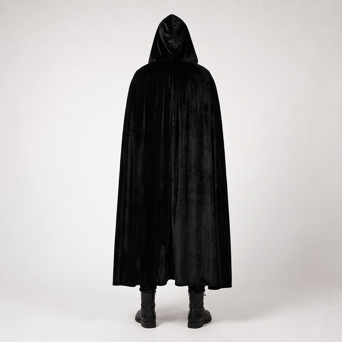 Man wearing long black hooded velvet cloak, standing, rear view | Chaps London