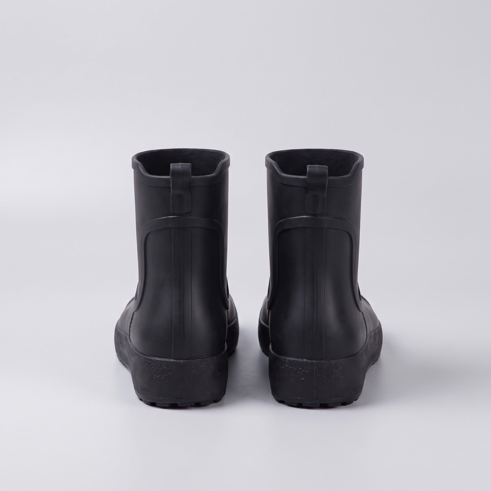 Black ankle wellies, rear view, flat lay on gray background | Chaps London