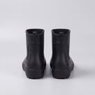 Black ankle wellies, rear view, flat lay on gray background | Chaps London