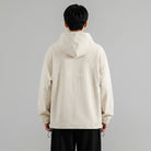 Man wearing cream waffle-texture hooded jacket with drawcord hem, rear view | Chaps London