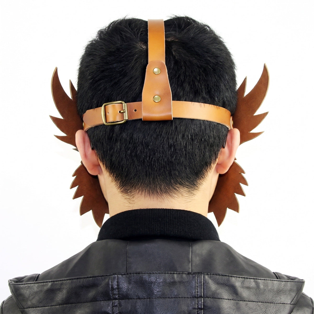 Brown faux leather mask straps with wing details, worn by man, back view | Chaps London