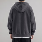 Dark gray oversized zip hoodie worn by man, back view, hood up | Chaps London