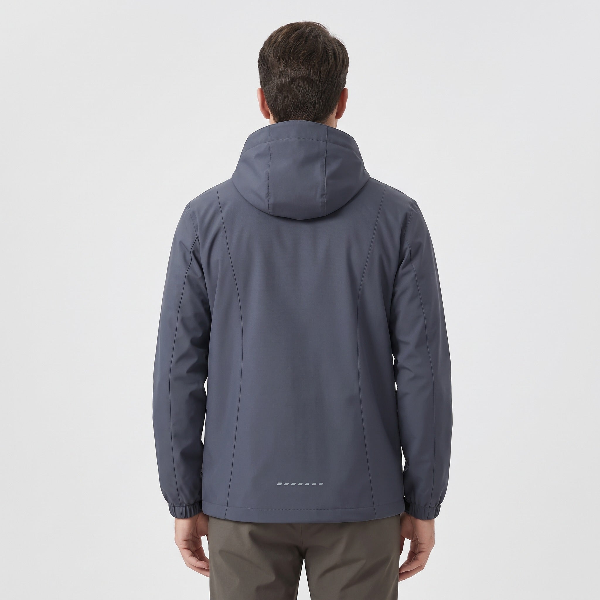 Man wearing dark grey hooded rain jacket, back view, standing | Chaps London