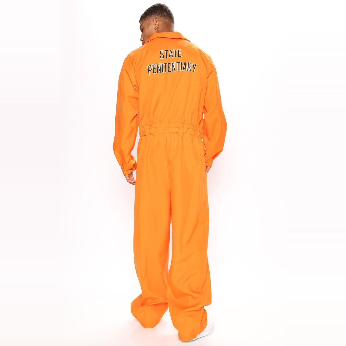 Man wearing orange prisoner jumpsuit costume, back view, standing pose | Chaps London