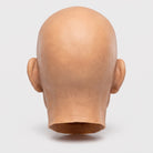 Rear view of bald latex mask head, skin-tone color, no hair visible | Chaps London