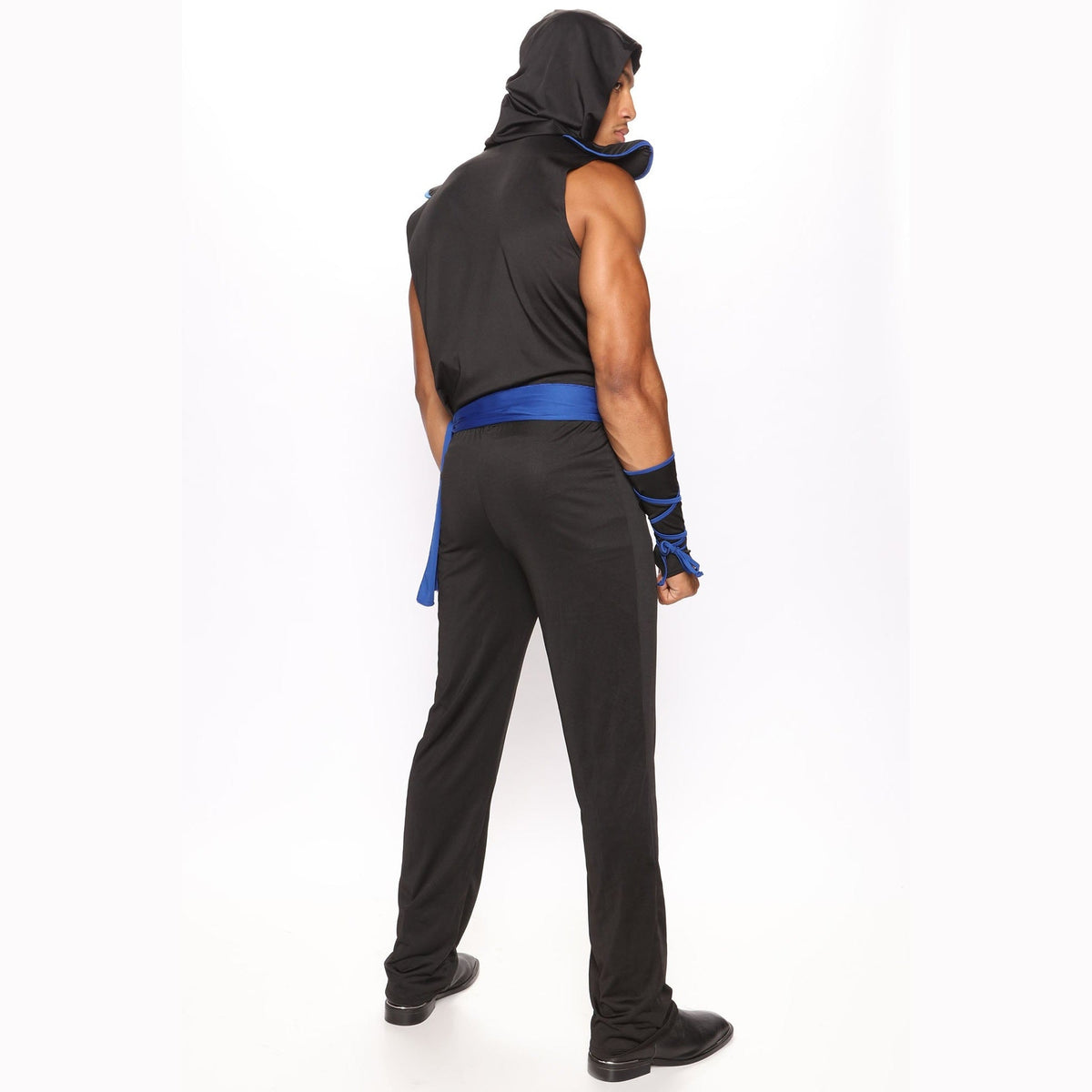Man wearing black ninja costume with blue sash, worn, rear view | Chaps London