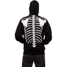 Black hooded sweatshirt with white skeleton ribcage print, worn by person, back view | Chaps London