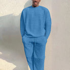 Man wearing blue textured knit sweater and matching lounge pants outdoors | Chaps London