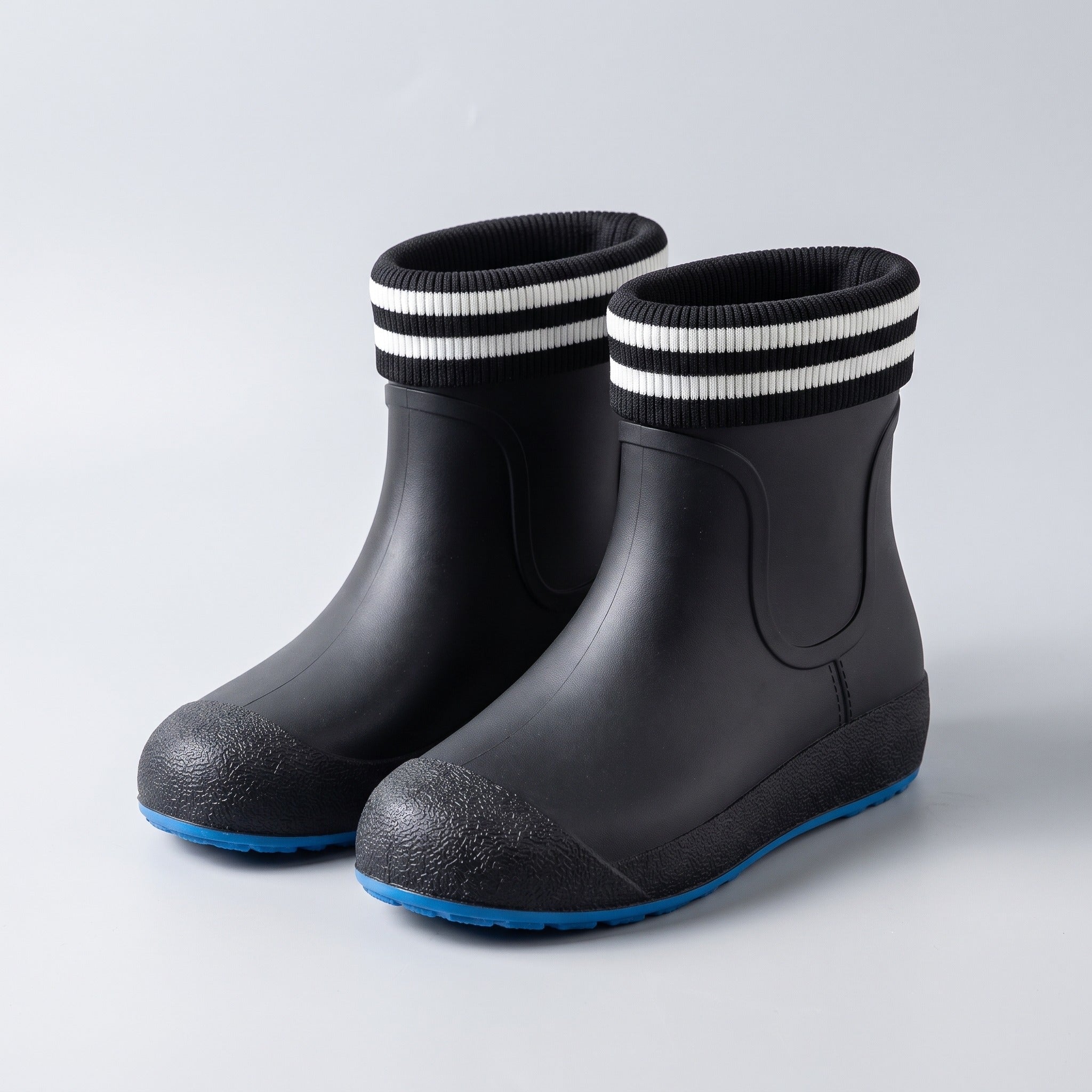 Black ankle wellies with striped cuffs and blue soles, shown flat | Chaps London
