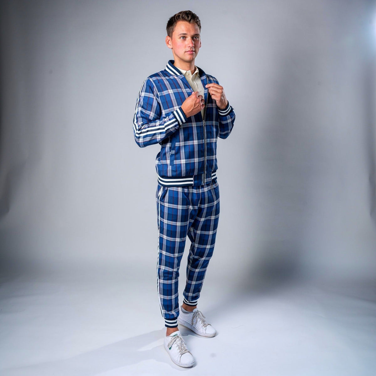 Man wearing blue plaid zip track jacket and matching jogger pants | Chaps London