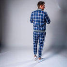 Man wearing blue and white checkered tracksuit with striped trim, rear view | Chaps London