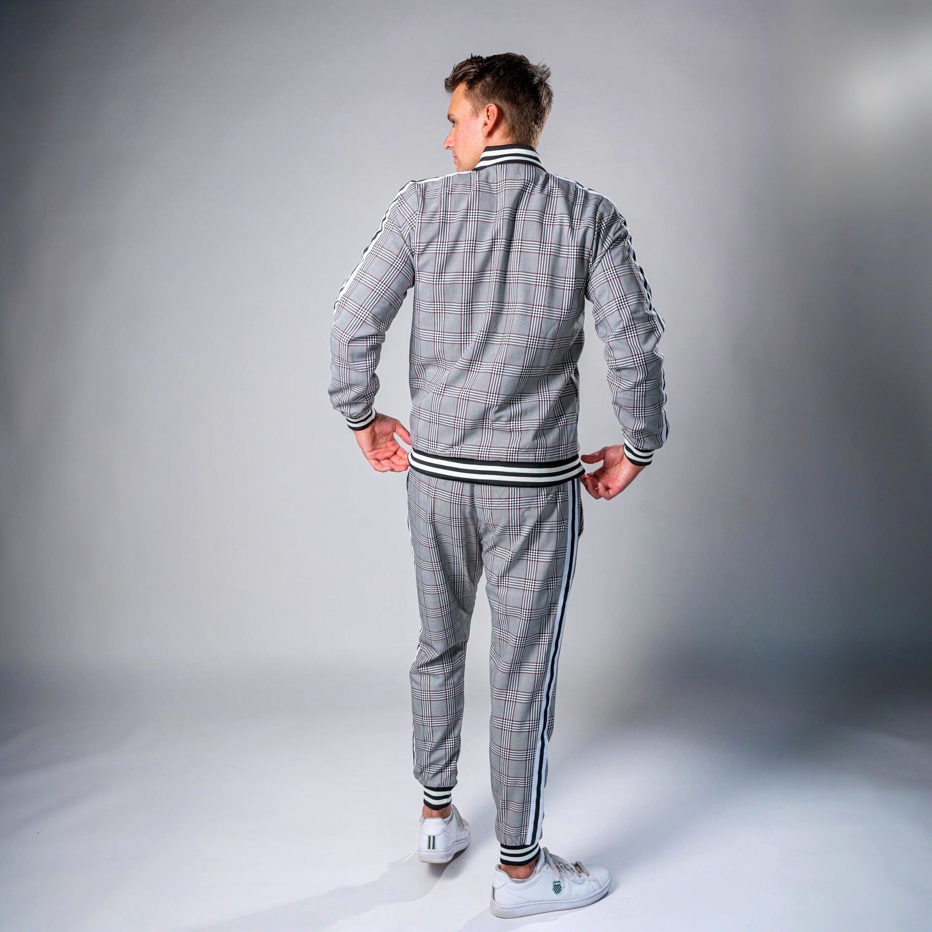 Man wearing grey check tracksuit with striped trim, zip jacket and joggers, back view | Chaps London
