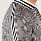 Black and white check track jacket with striped collar, worn by person | Chaps London