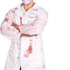 White doctor coat with red blood splatter stains, worn by person, face mask visible | Chaps London