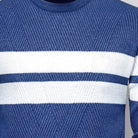 Blue knitted jumper with white block stripes, worn by person, close-up view | Chaps London
