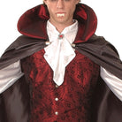 Man wearing vampire costume with red collar cape and vest | Chaps London