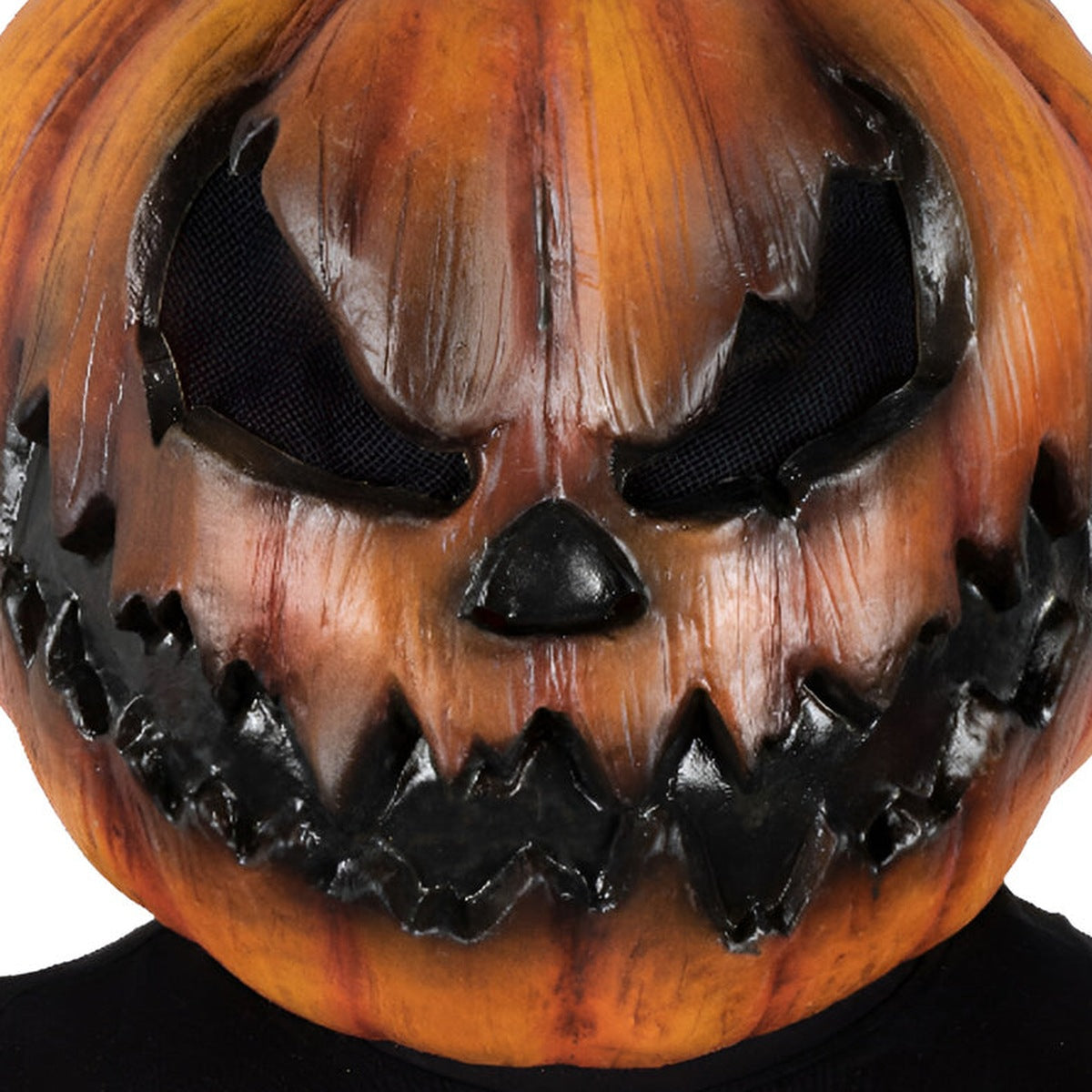 Orange pumpkin mask with evil face worn by a person | Chaps London
