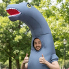 Man wearing gray inflatable long-neck dinosaur costume, giving thumbs up outdoors | Chaps London