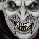 Grey vampire mask worn by person, bloody fangs and wrinkled texture | Chaps London