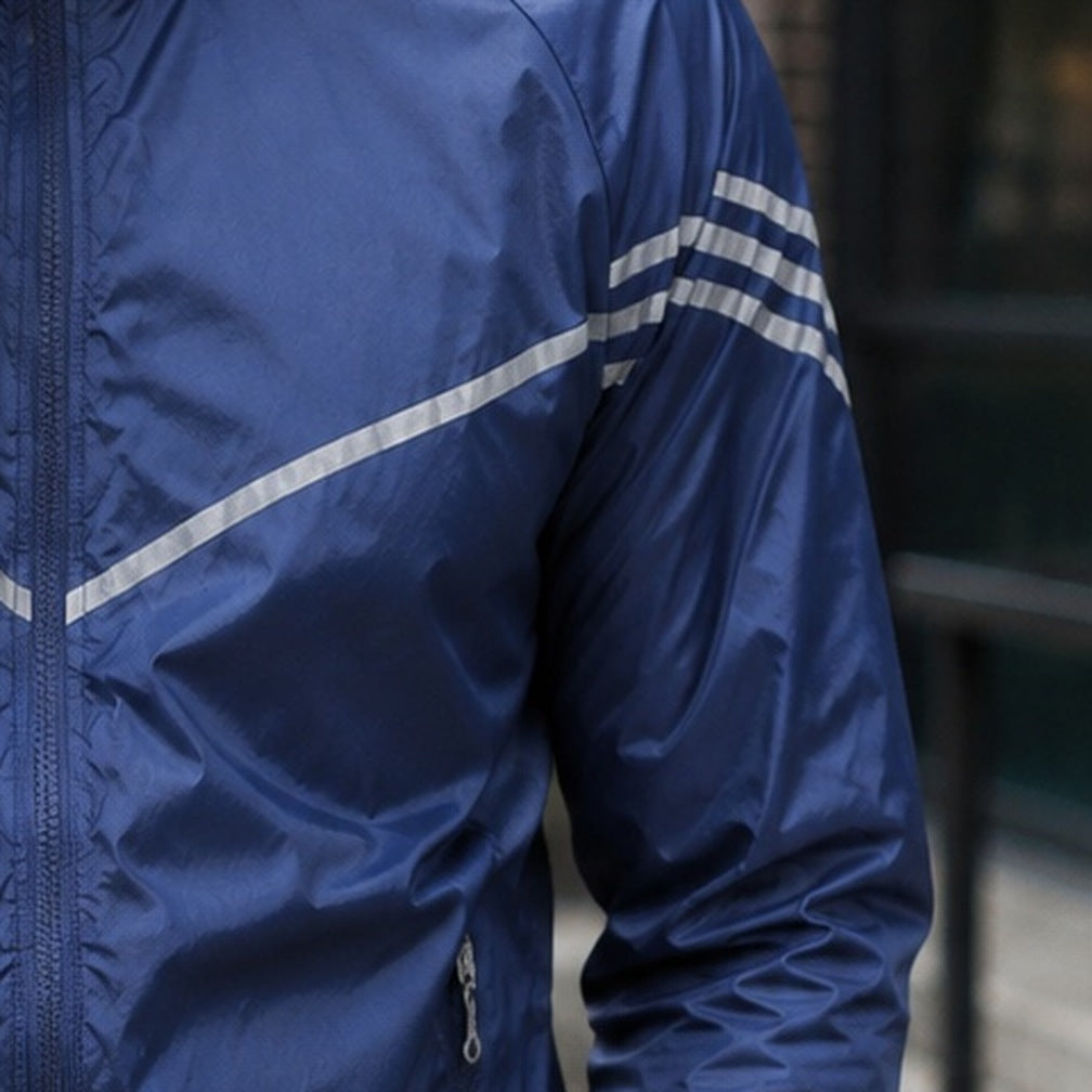 Navy blue nylon jacket with reflective stripes, worn by person outdoors | Chaps London