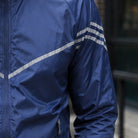 Navy blue nylon jacket with reflective stripes, worn by person outdoors | Chaps London