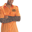 Man wearing orange prisoner costume shirt with tattoo sleeve on arm | Chaps London
