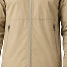 Beige rain jacket close-up showing zip pockets and stitched front seam, worn by person | Chaps London