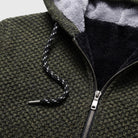 Close-up of olive chunky knit hoodie zipper and drawstring detail, fleece lining visible | Chaps London