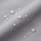 Water droplets beading on gray water-repellent fabric, close-up texture detail | Chaps London