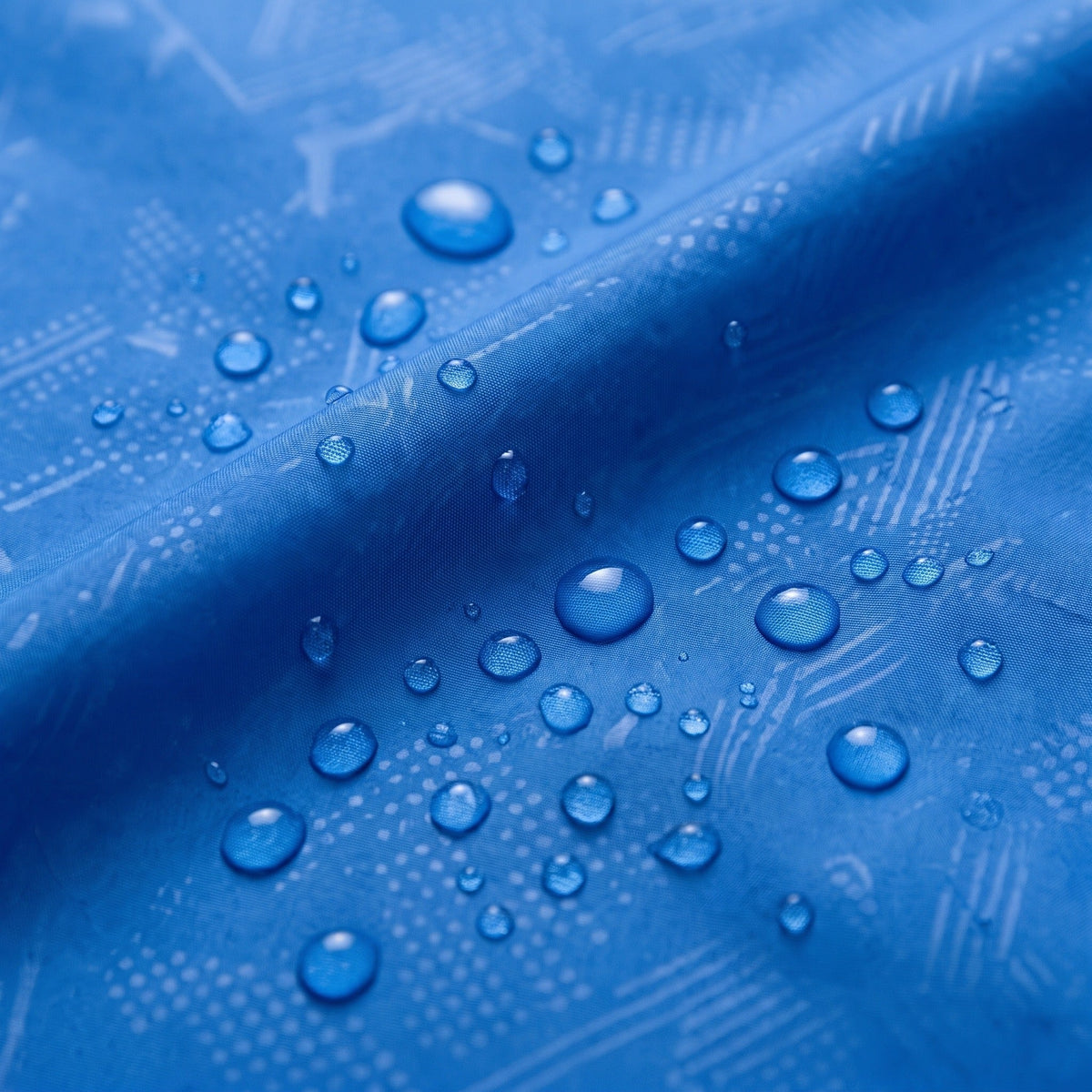 Blue waterproof fabric with water droplets beaded on textured surface, close-up view | Chaps London