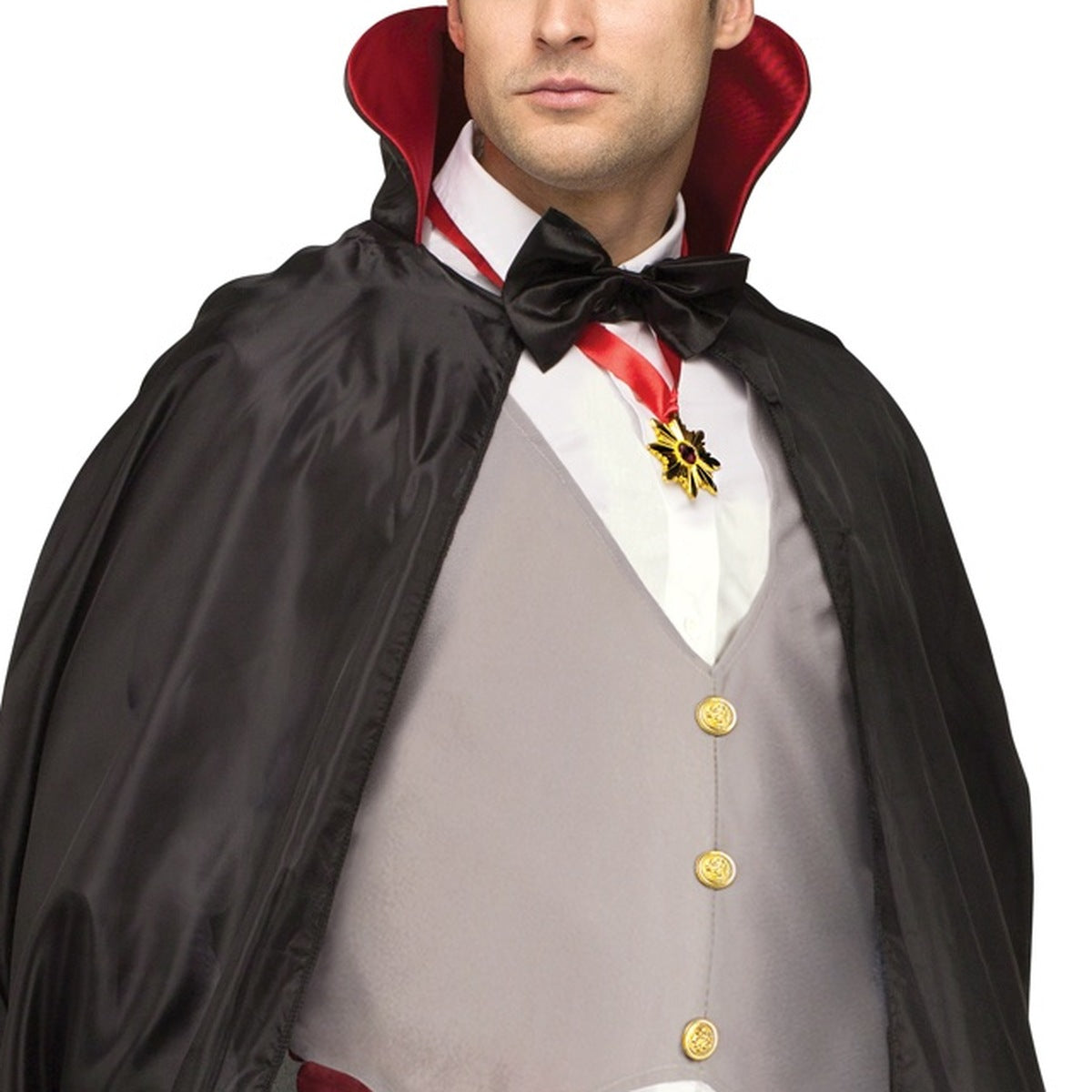 Man wearing black vampire cape with red collar and medallion | Chaps London