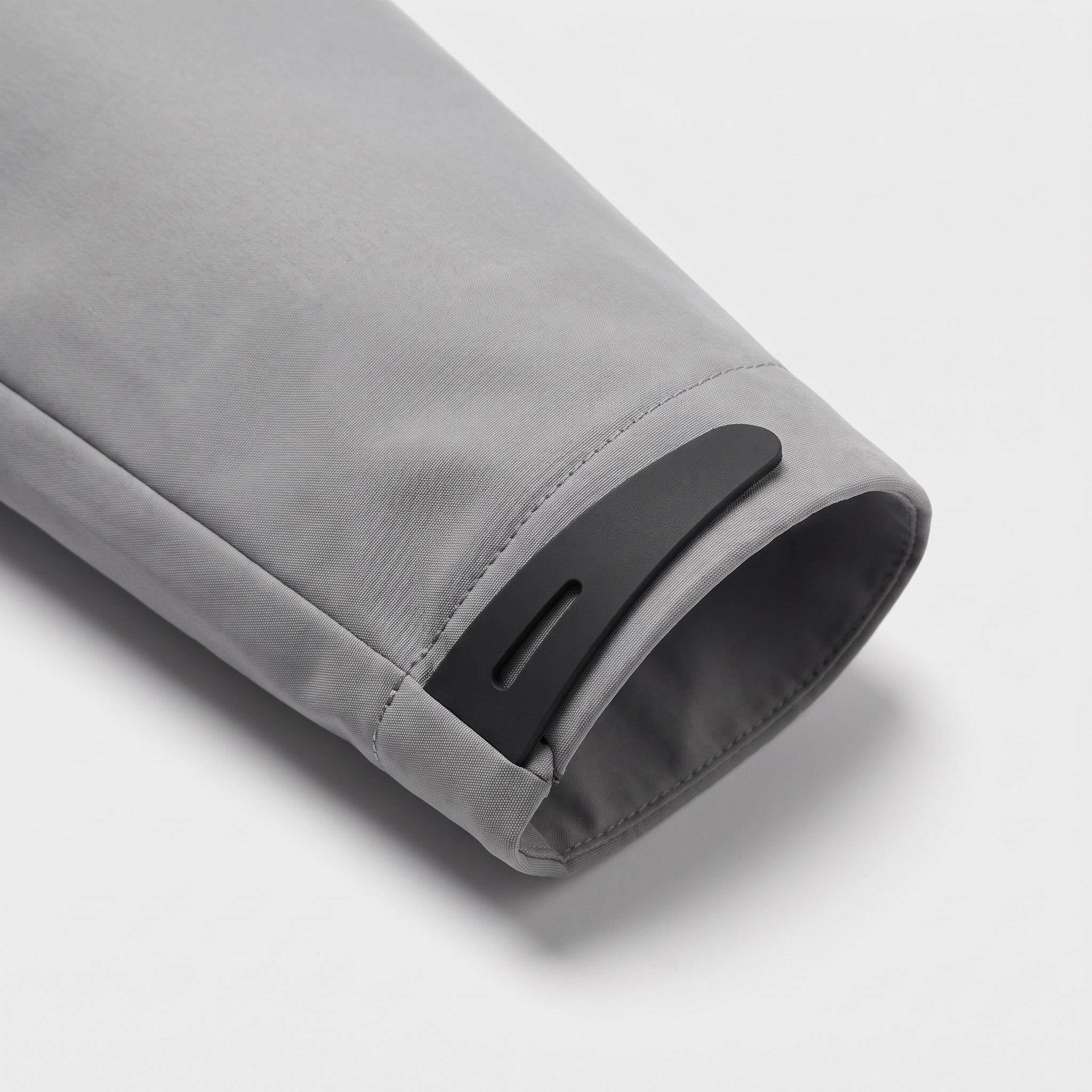 Gray jacket sleeve close-up showing cuff tab and adjustable strap detail | Chaps London