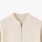 Cream ribbed knit cardigan with stand collar, zipper close-up, worn by person | Chaps London