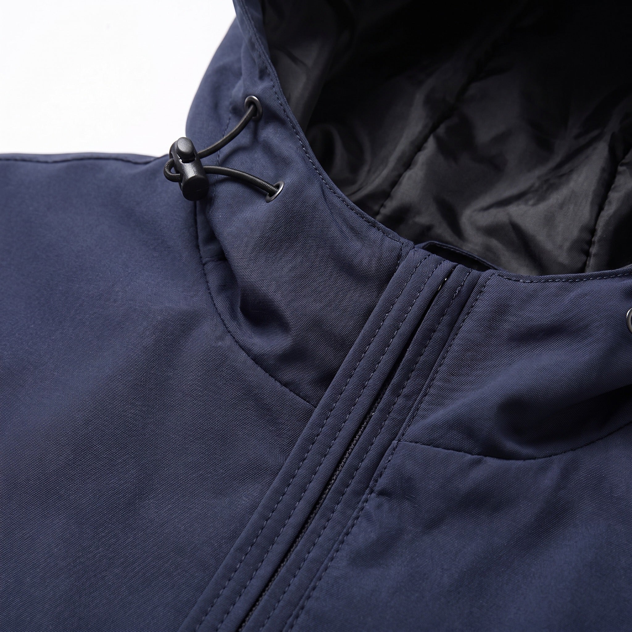Close-up of navy jacket hood with drawstring toggle and zipper detail | Chaps London