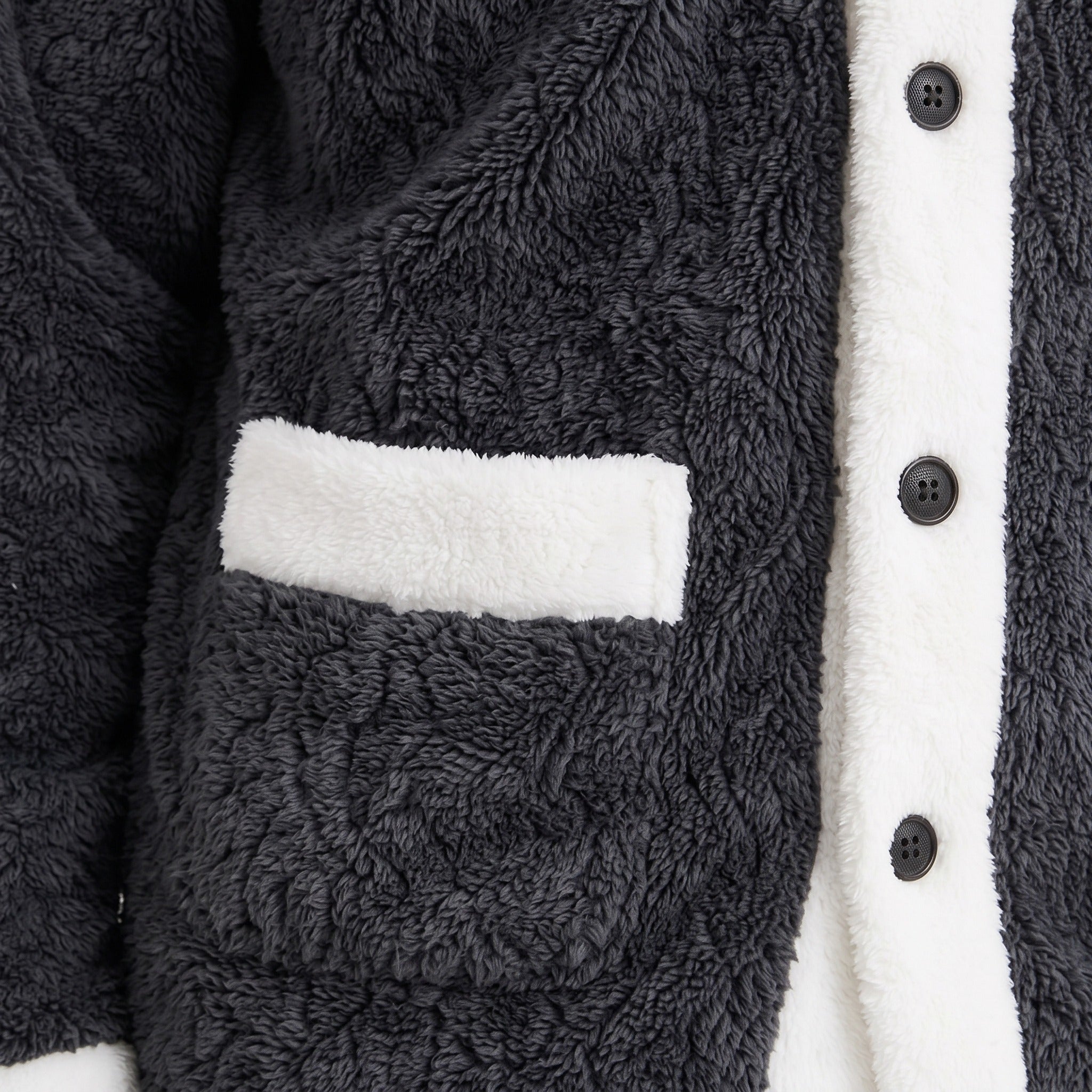 Close-up of dark grey coral fleece jacket with white trim and pocket | Chaps London
