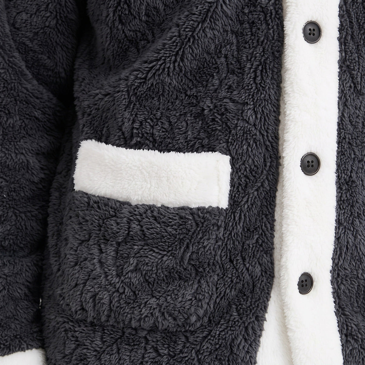 Close-up of dark grey coral fleece jacket with white trim and pocket | Chaps London