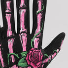 Black glove with pink skeleton bone print and red rose design, worn on hand | Chaps London