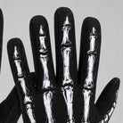 Black glove with white skeleton bone print worn on hand | Chaps London